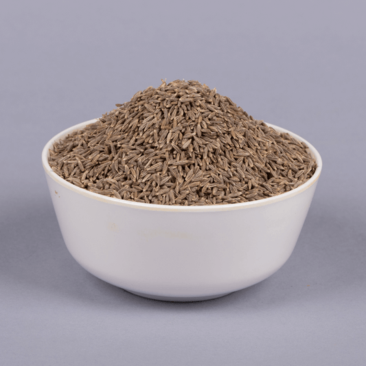 Premium quality cumin seeds jeera in a glass bowl for cooking.